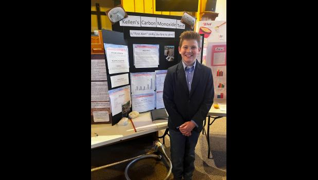 Kellen Lewis is pictured above with his first place Science Fair entry. Lewis tested different brands of carbon monoxide detectors to find out which one was first to alert. photo provided