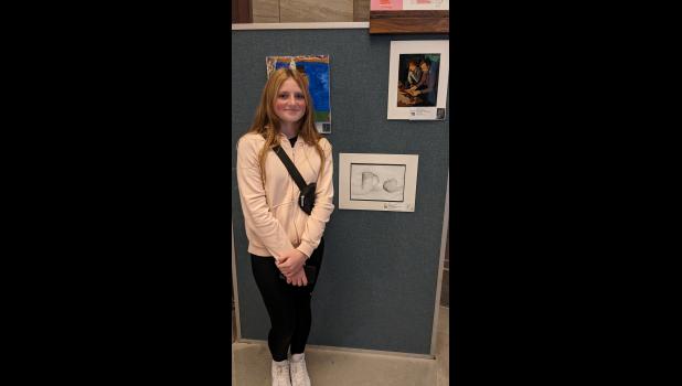 Isabella Voytukov represents Willow Springs Middle School at the Youth Art Month awards assembly. photo provided