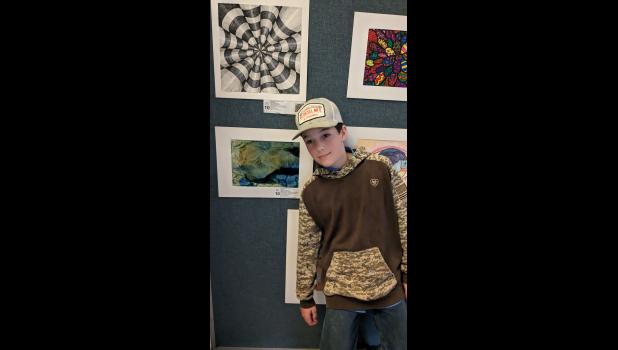 Holden Dancer represents Willow Springs Middle School at the Youth Art Month awards assembly. photo provided