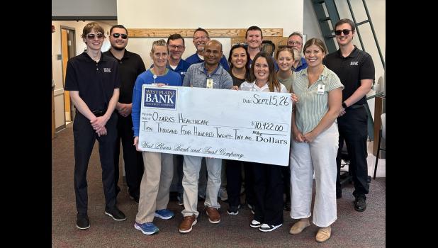 West Plains Bank and Trust Company recently made a $10,422 donation to Ozarks Healthcare (OZH). The donation was funded by proceeds from the Community Debit Card program. Each time an OZH card is used to make a purchase at a retailer, West Plains Bank and Trust Company adds to a donation which is presented annually. Pictured are therapists with OZH Rehabilitation Services, OZH Foundation Representative Sammi Radosovich, and representatives with West Plains Bank and Trust Company. Since the program was launched in 2012, the bank has donated more than $807,000 to education and health care. photo provided