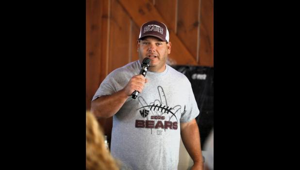 Head coach Jake Berkshire addresses the crowd at the annual fundraising dinner. courtesy of Shawana Cox