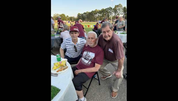 (L-R) Lonnie Whitaker (WSHS 1965), Wendell Bailey (WSHS 1958), and Forrest "Ike" Lovan (WSHS 1953) in the west endzone before kickoff at the 100-year football celebration.