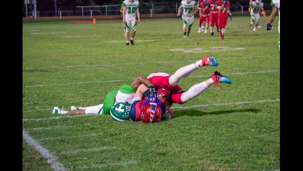 A Thayer player took Jester down. (Howell County News/ Gretchen Creighton Photography)