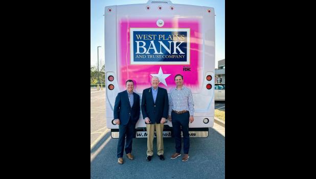 Josh Reeves, Vice President of Development at Ozarks Healthcare (left), Ken Joplin, Chairman of the Ozarks Healthcare Foundation Board of Directors (middle), and David M. Gohn, West Plains Bank and Trust Company President/Chief Executive Officer (right), pose at the back of Ozarks Healthcare’s new mobile mammography unit. West Plains Bank and Trust Company donated $250,000 to the Ozarks Healthcare Foundation’s fundraising campaign to purchase a mobile mammography unit. photo provided