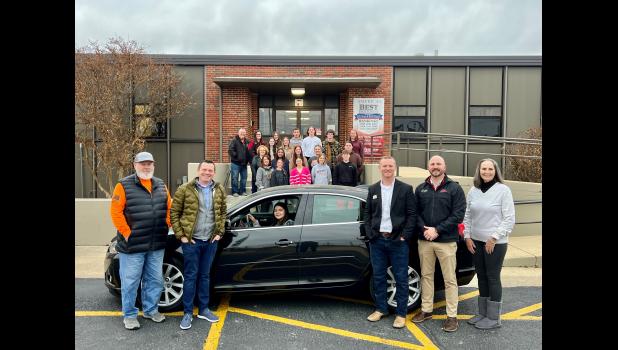 West Plains School District administration, staff and students happily accept a car donated by Southern Hills Auto Plazza to kickstart the driver's education program. photo provided