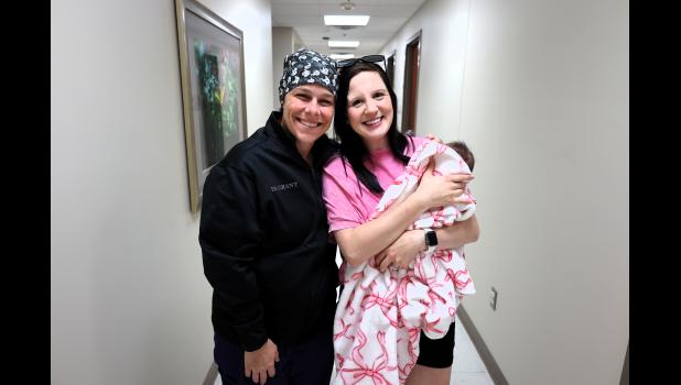 Kristina Grant, DO, family medicine and obstetrics physician, left; Mallorie Fleener, TCMH obstetrics patient, holding baby Braelyn, right. photo provided