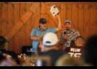 Mayor Adam Webb and auctioneer Eric King auction off a parking spot at Palenske Field for home games. courtesy of Shawana Cox
