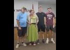 Annie Glenn, court clerk, has earned the title certified court administrator. Glenn is pictured with her husband, Richard, and children Kyle and Gavin Glenn. Howell County News/ Amanda Mendez