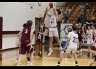 Eighth-grader Braxton Wilbanks shooting over a Mountain Grove defender as the Bears win 48 to 22. (courtesy photo/ Shawana Cox)