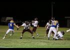 Quarterback Owen Duddridge winding up to throw the ball. (courtesy photo/ Shawana Cox)