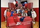 West Plains High School Senior Aubree Hugg, a member of the Lady Zizzer Soccer team, signed her letter of intent with Mission University on Friday, April 10. Hugg is pictured center at the table with her coaches Jessica Ball and Kourtney Stockton along with her teammates. photo provided